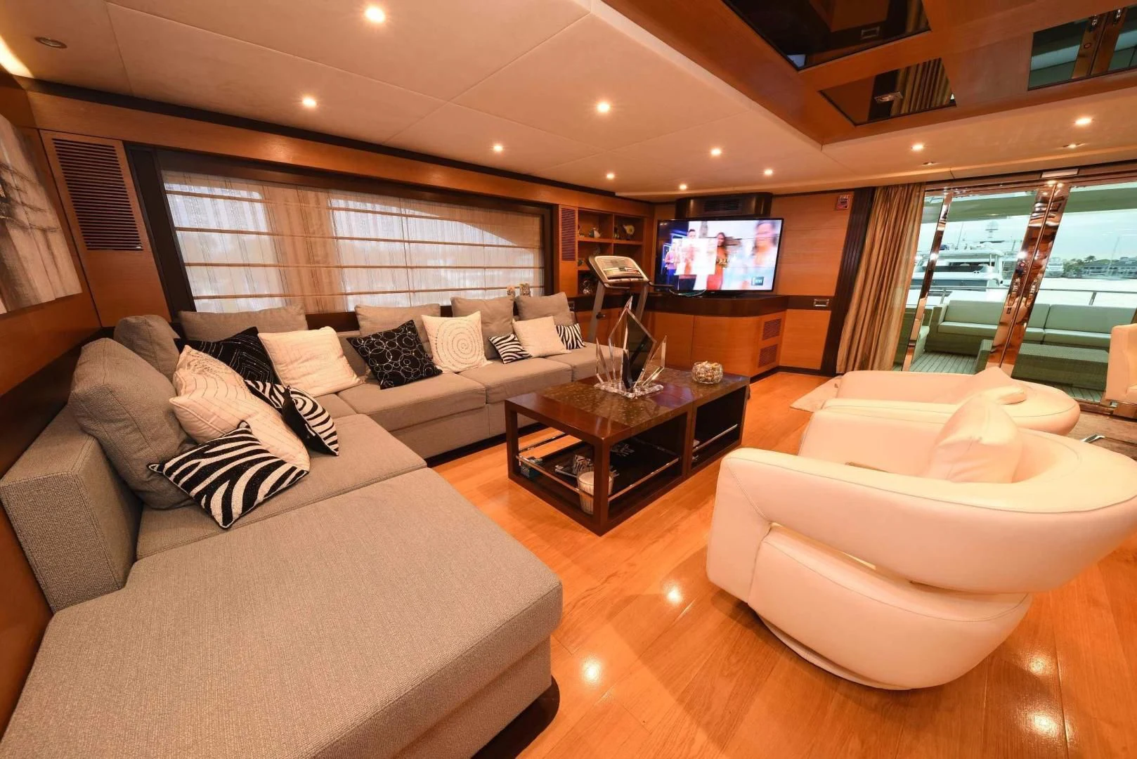 a living room with a large screen aboard KIMBERLIE Yacht for Sale