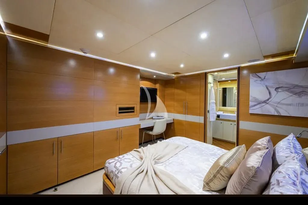 a room with a bed and a chair aboard KIMBERLIE Yacht for Sale