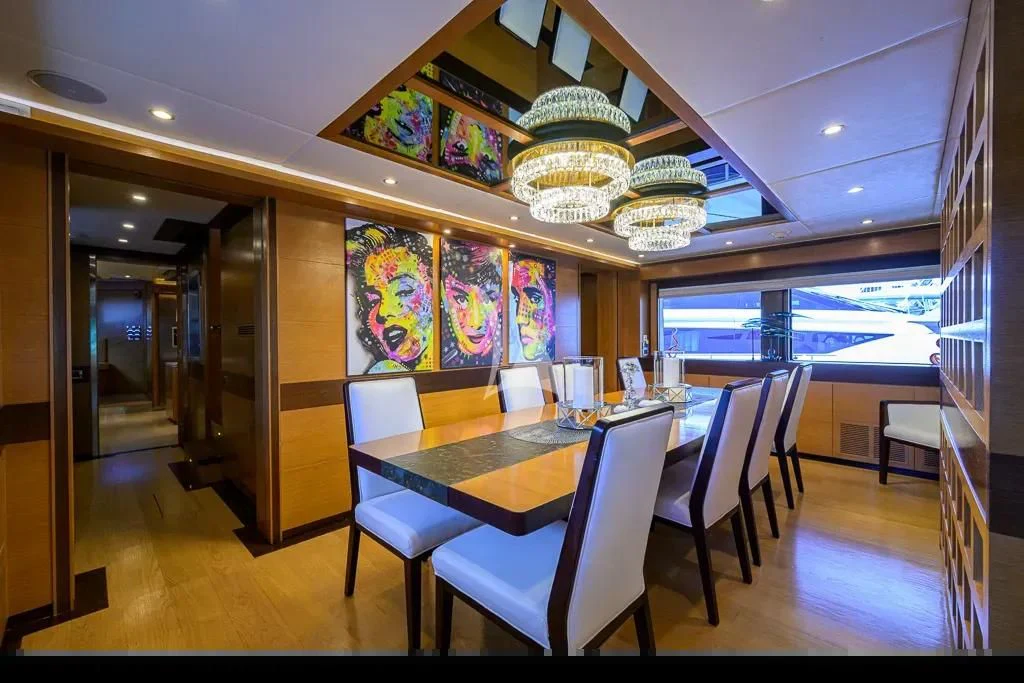 a room with a table and chairs aboard KIMBERLIE Yacht for Sale