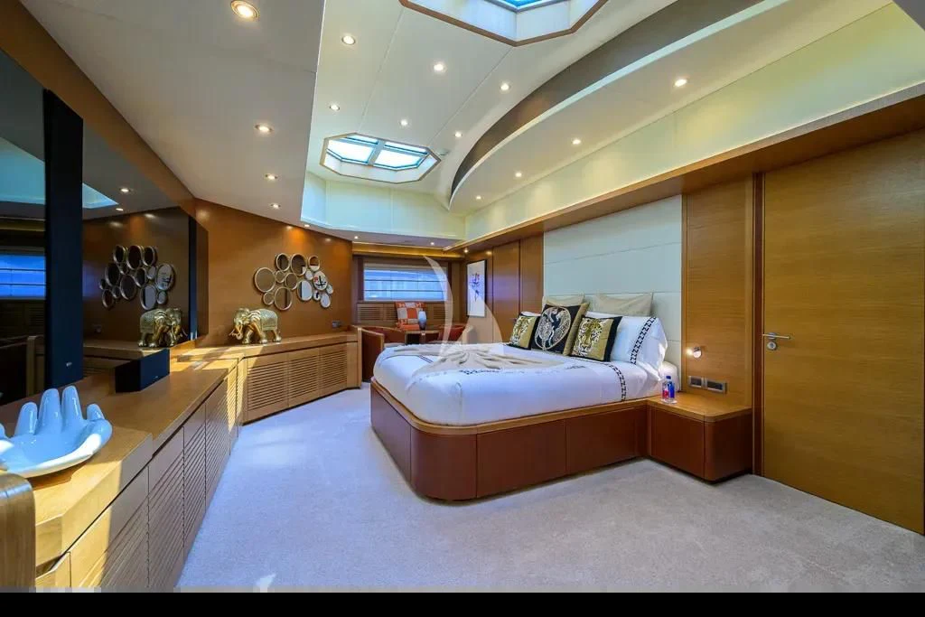 a bedroom with a large bed aboard KIMBERLIE Yacht for Sale