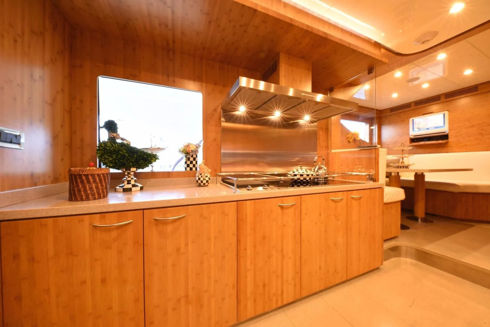 a kitchen with wooden cabinets aboard KIMBERLIE Yacht for Sale