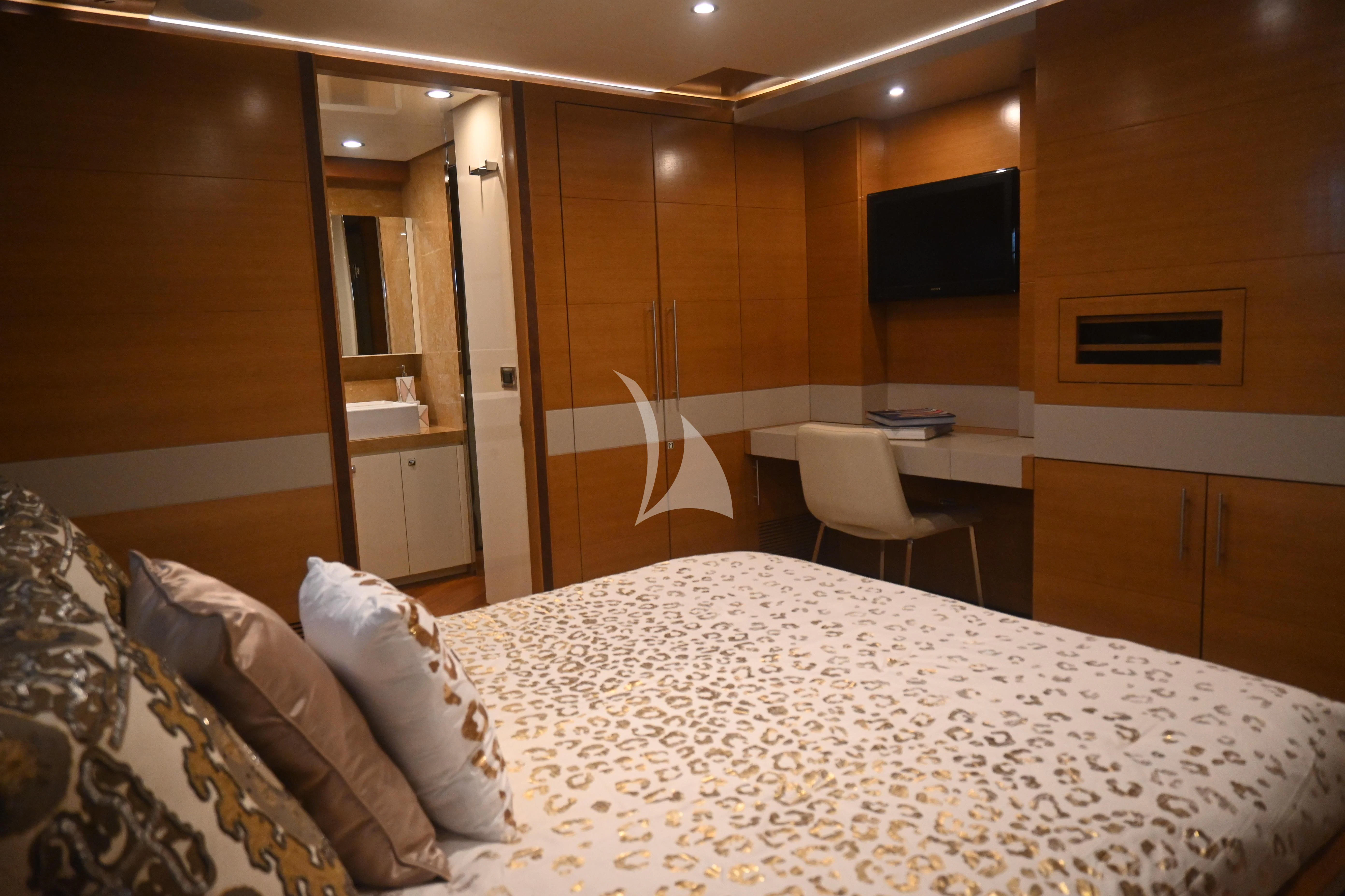 a room with a bed and a chair aboard KIMBERLIE Yacht for Sale