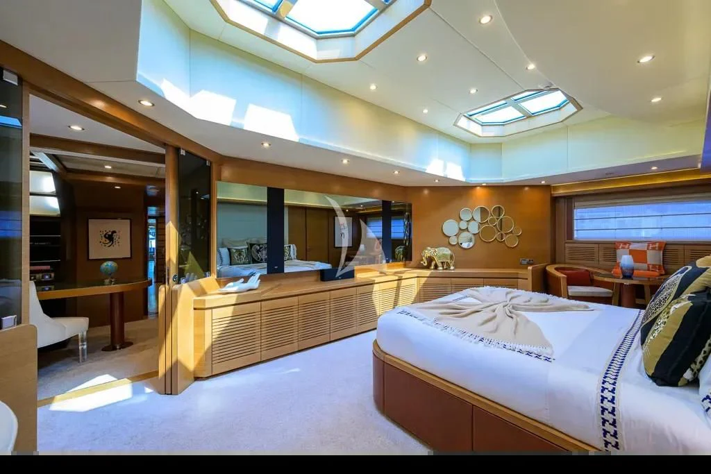 a room with a bed and a desk aboard KIMBERLIE Yacht for Sale