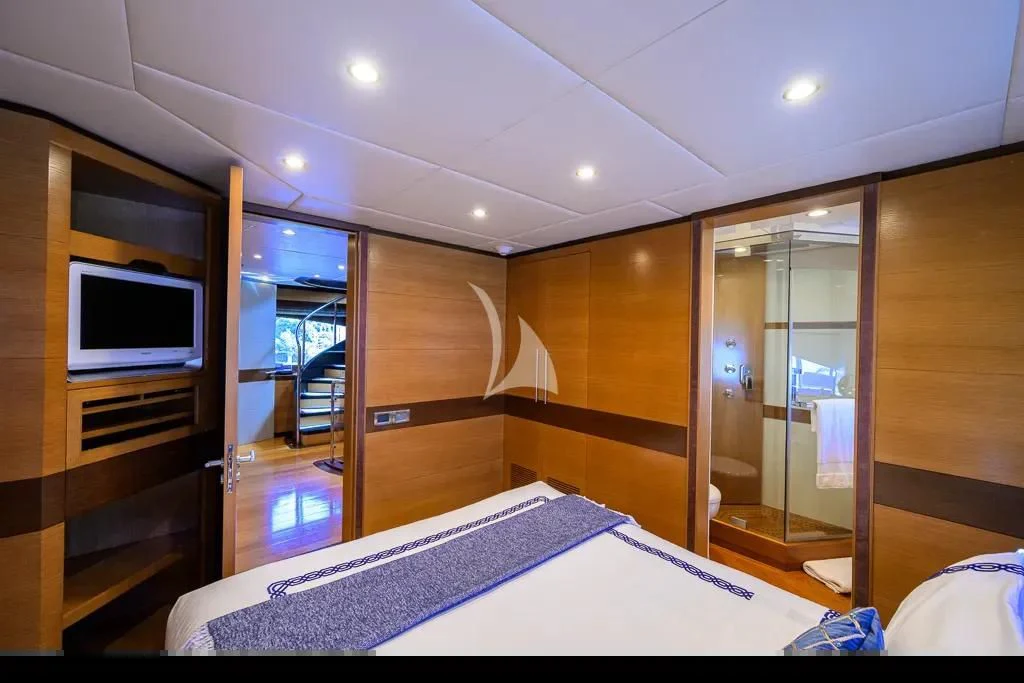 a bedroom with a large mirror aboard KIMBERLIE Yacht for Sale