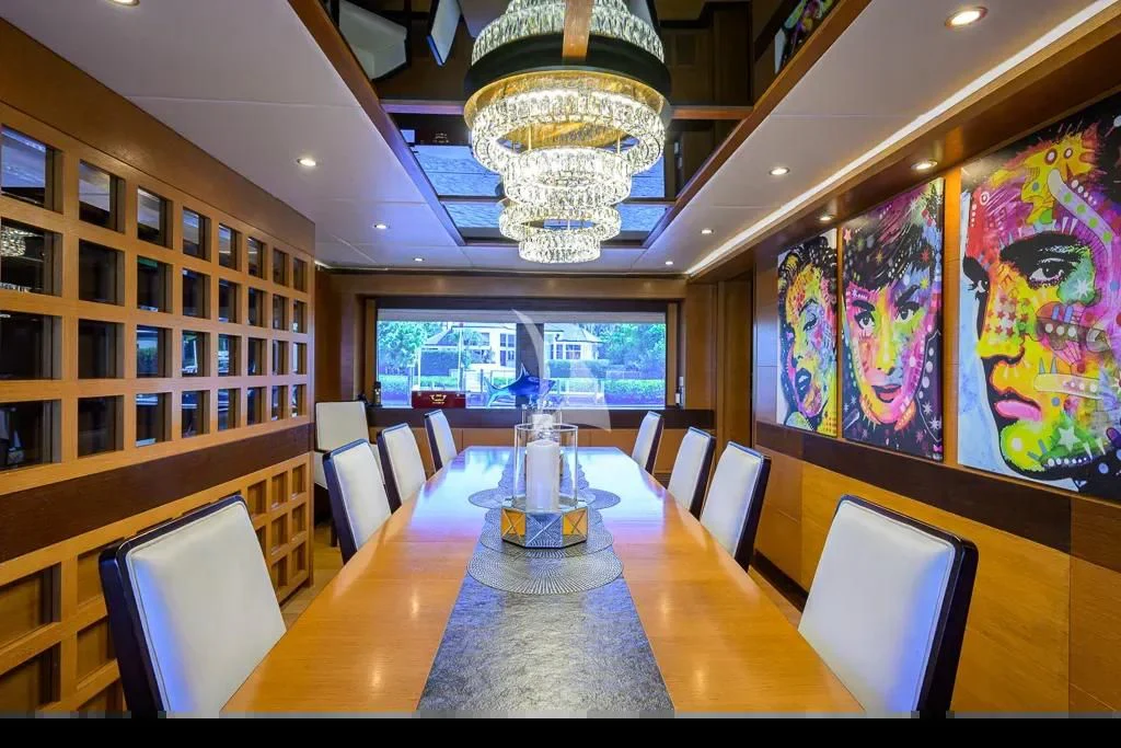 a room with a table and chairs aboard KIMBERLIE Yacht for Sale
