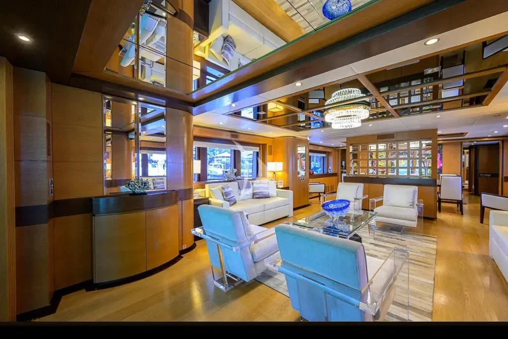 a room with a table chairs and a window aboard KIMBERLIE Yacht for Sale
