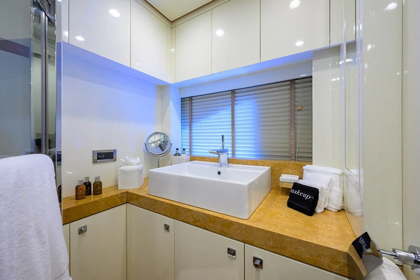a bathroom with a sink and a mirror aboard KIMBERLIE Yacht for Sale