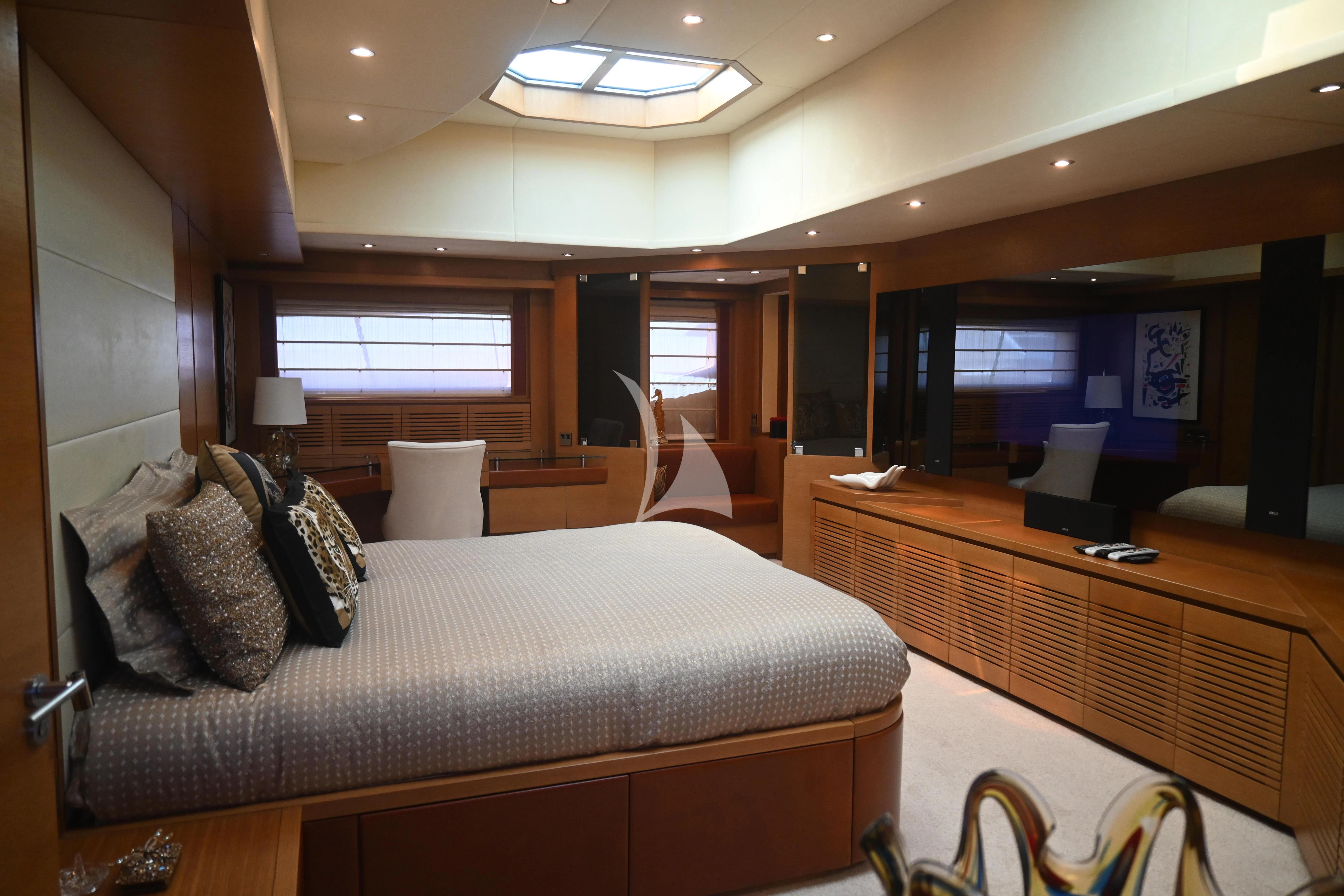 a hotel room with a bed and desk aboard KIMBERLIE Yacht for Sale