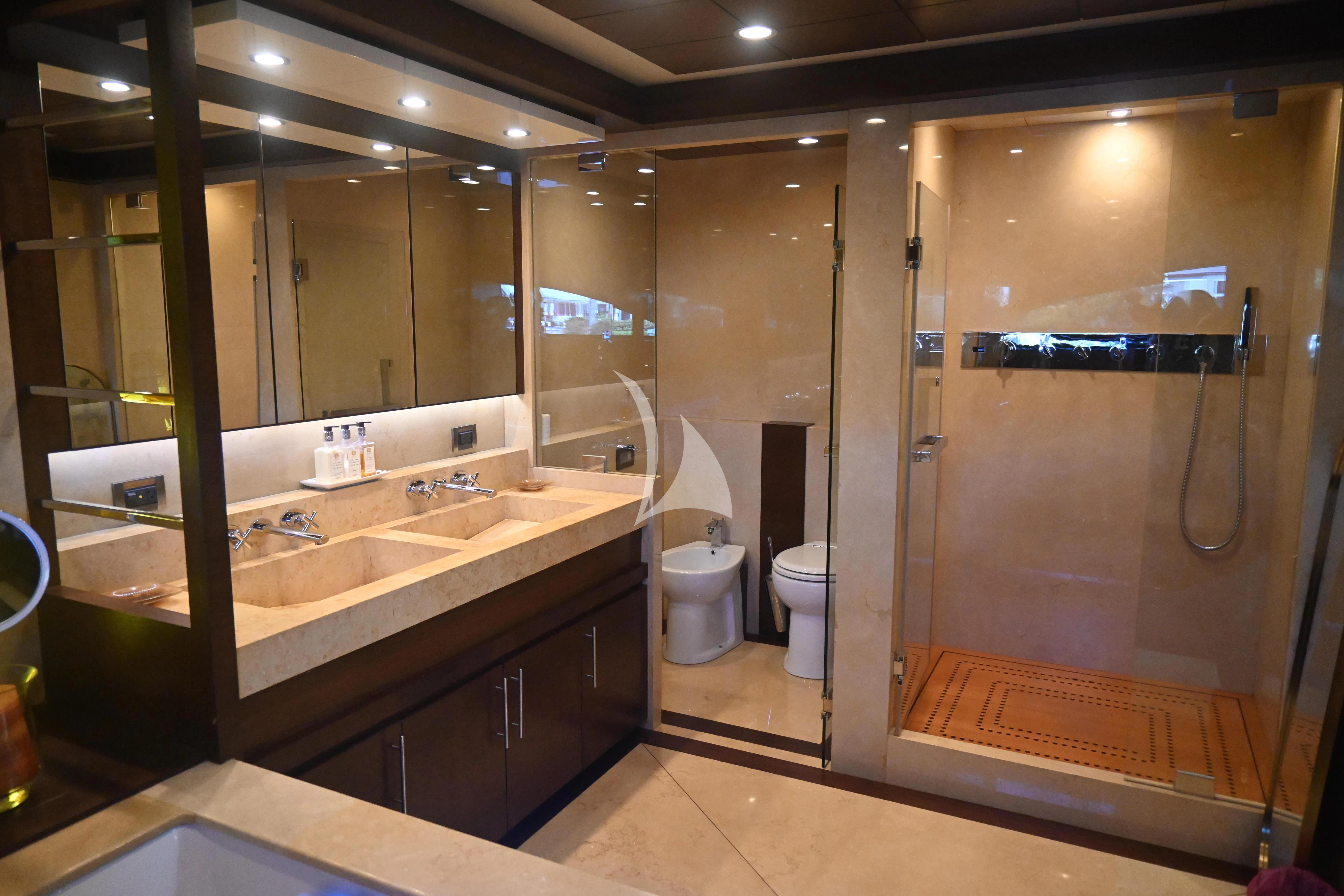 a bathroom with a large mirror aboard KIMBERLIE Yacht for Sale
