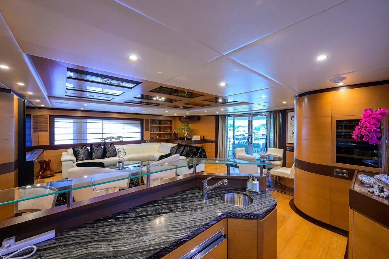 a large living room with a large glass window aboard KIMBERLIE Yacht for Sale