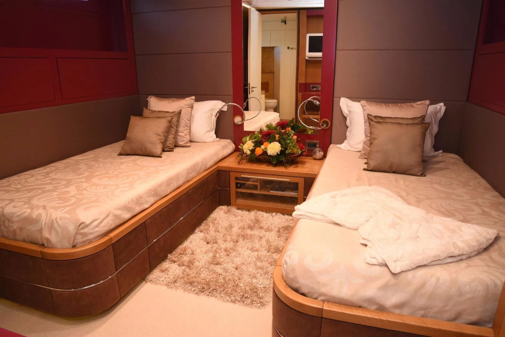 a room with a couple of beds aboard KIMBERLIE Yacht for Sale
