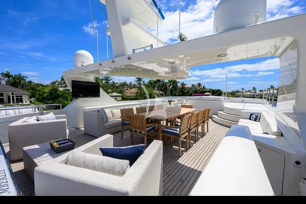 a large white building with a large patio and a pool aboard KIMBERLIE Yacht for Sale