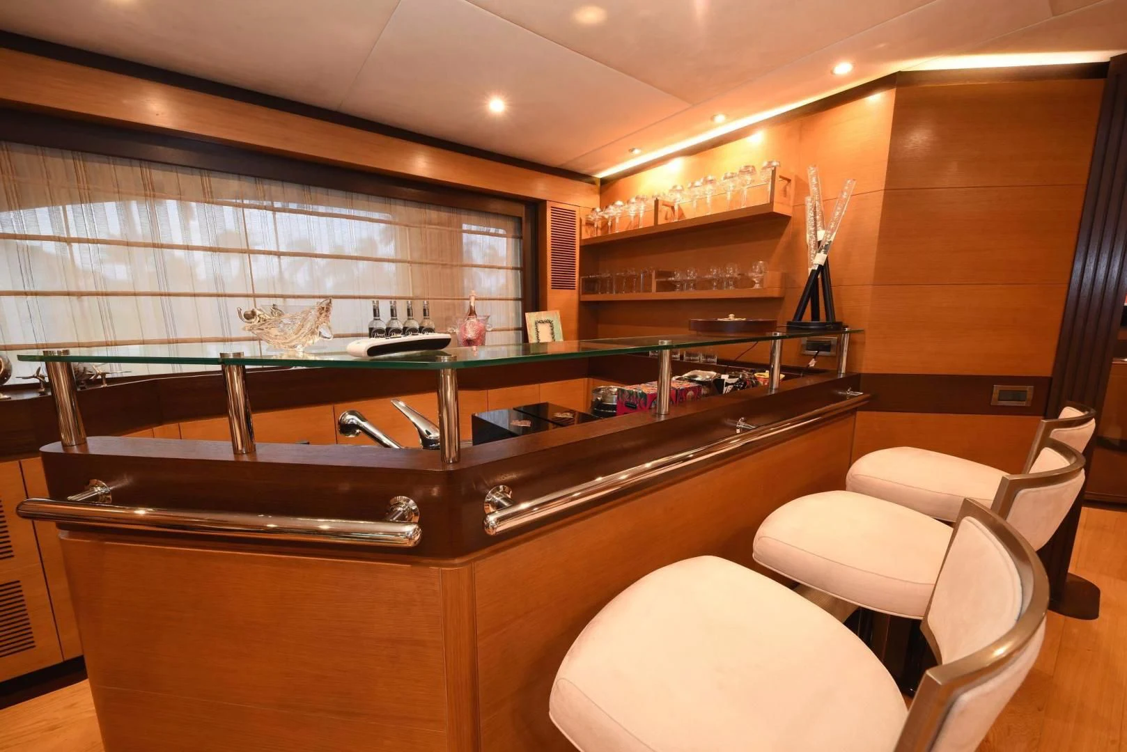 a kitchen with a bar and stools aboard KIMBERLIE Yacht for Sale