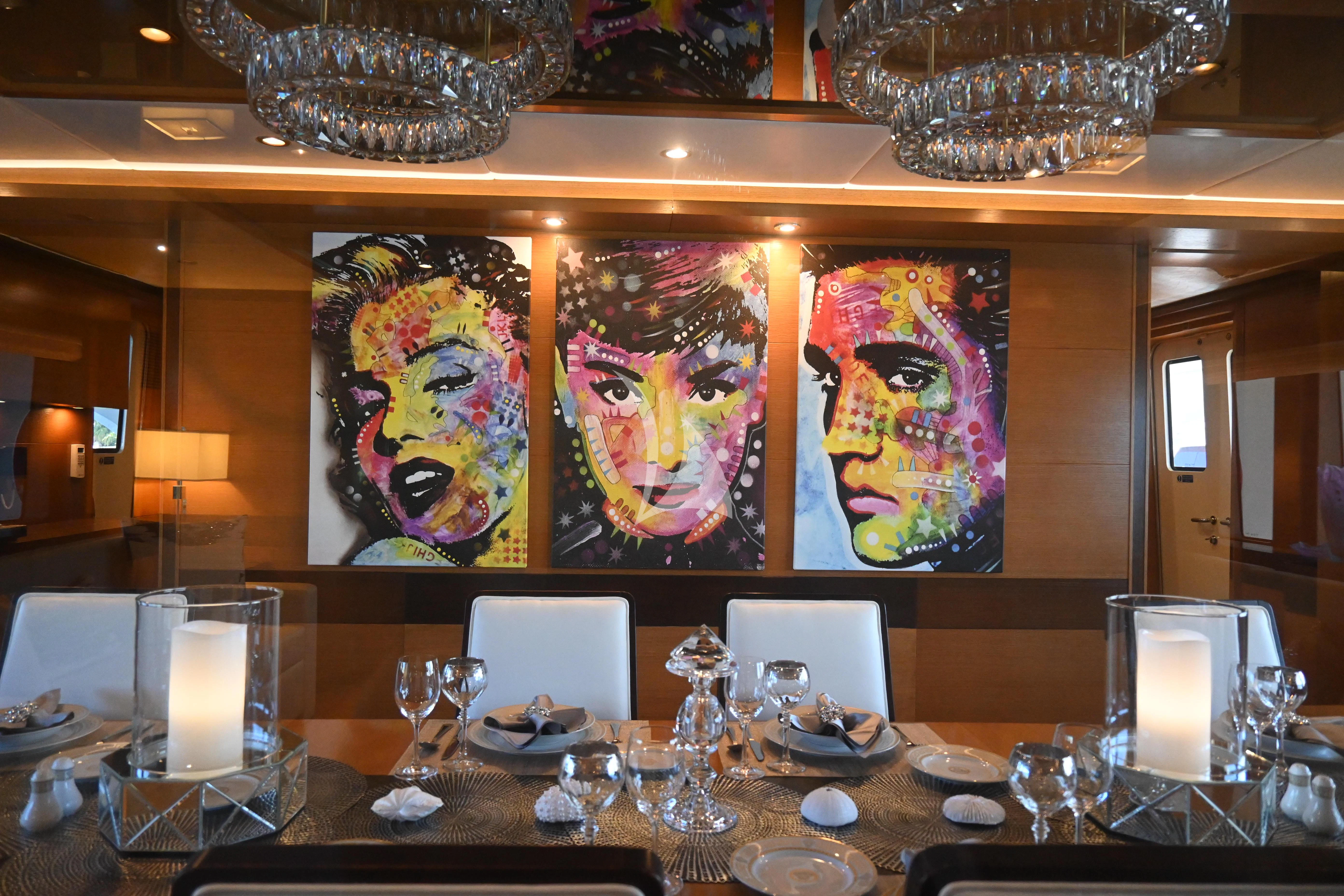 a table with many plates and glasses on it aboard KIMBERLIE Yacht for Sale