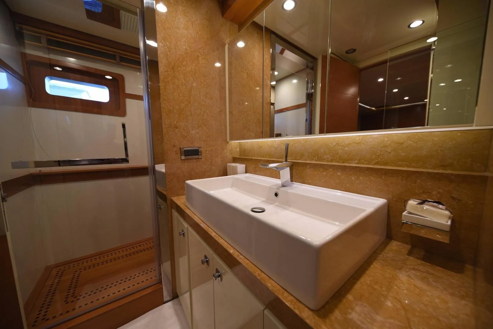 a bathroom with a sink and a mirror aboard KIMBERLIE Yacht for Sale