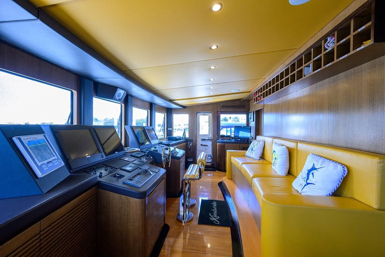 a room with a couch and a desk with computers aboard KIMBERLIE Yacht for Sale