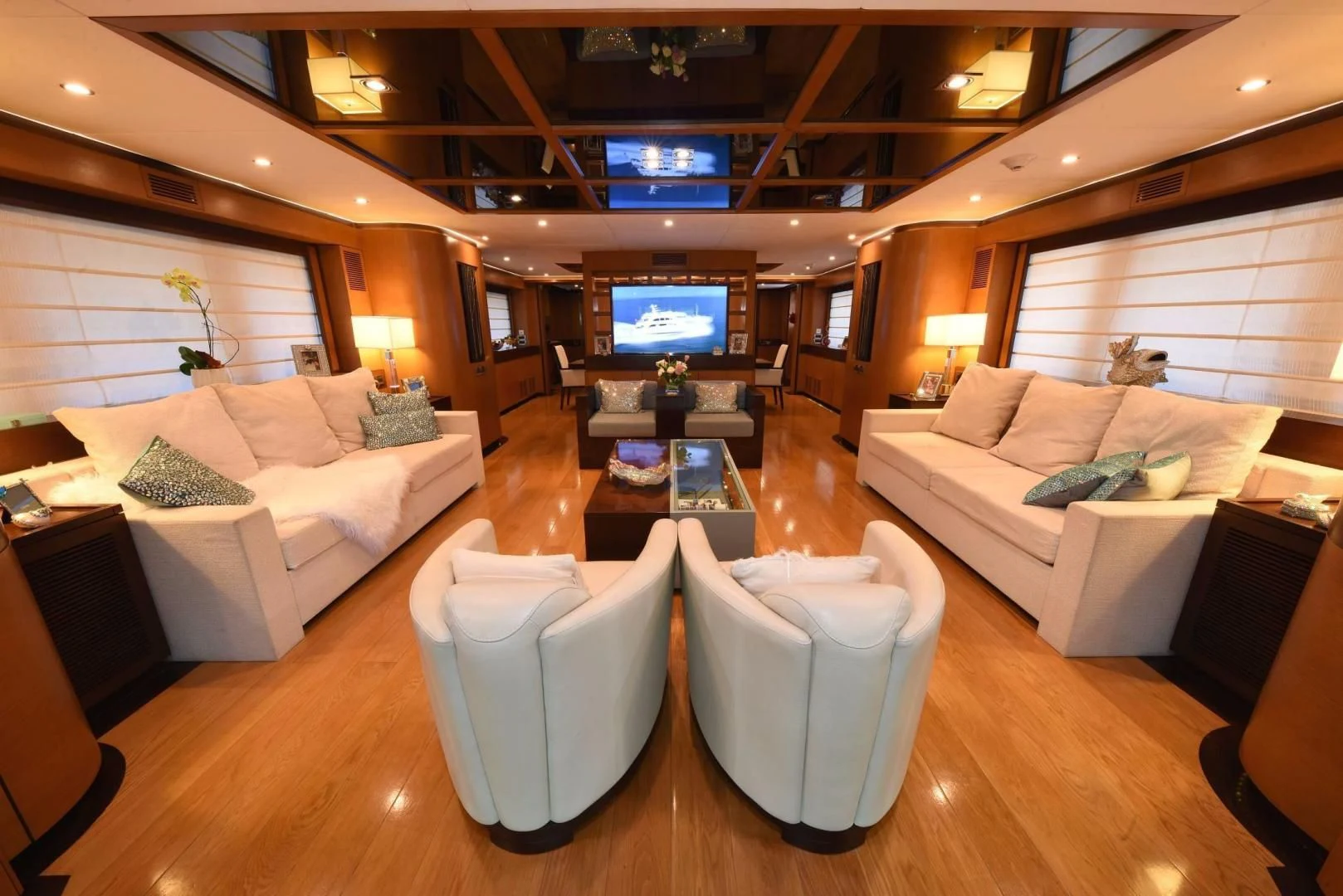 a living room with a large screen aboard KIMBERLIE Yacht for Sale
