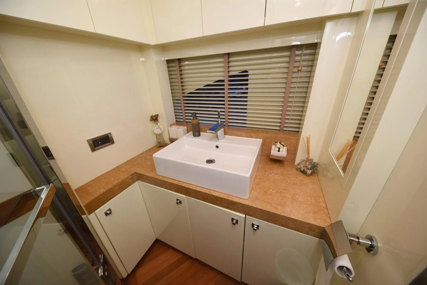 a bathroom with a sink and a window aboard KIMBERLIE Yacht for Sale