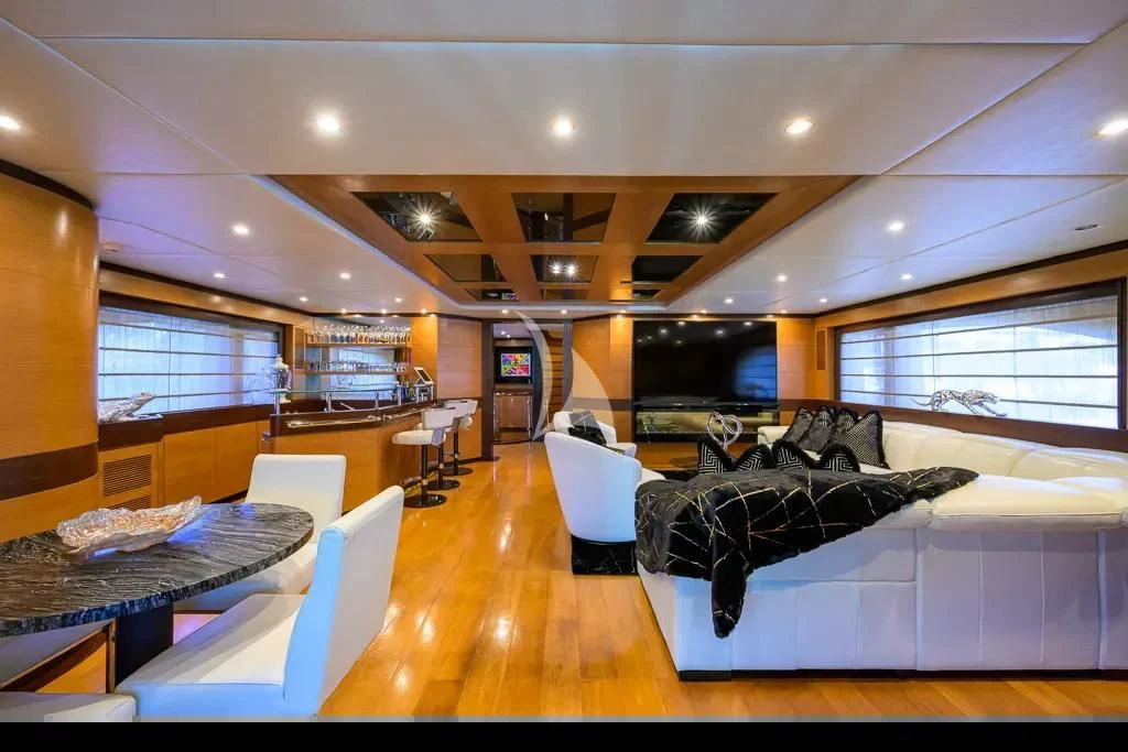 a large room with a couch and a table aboard KIMBERLIE Yacht for Sale