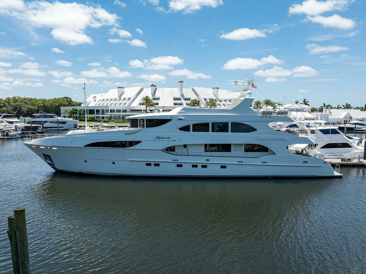a large white yacht in a harbor aboard KIMBERLIE Yacht for Sale