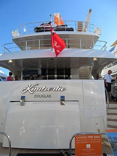 a large boat with a flag on the front aboard KIMBERLIE Yacht for Sale