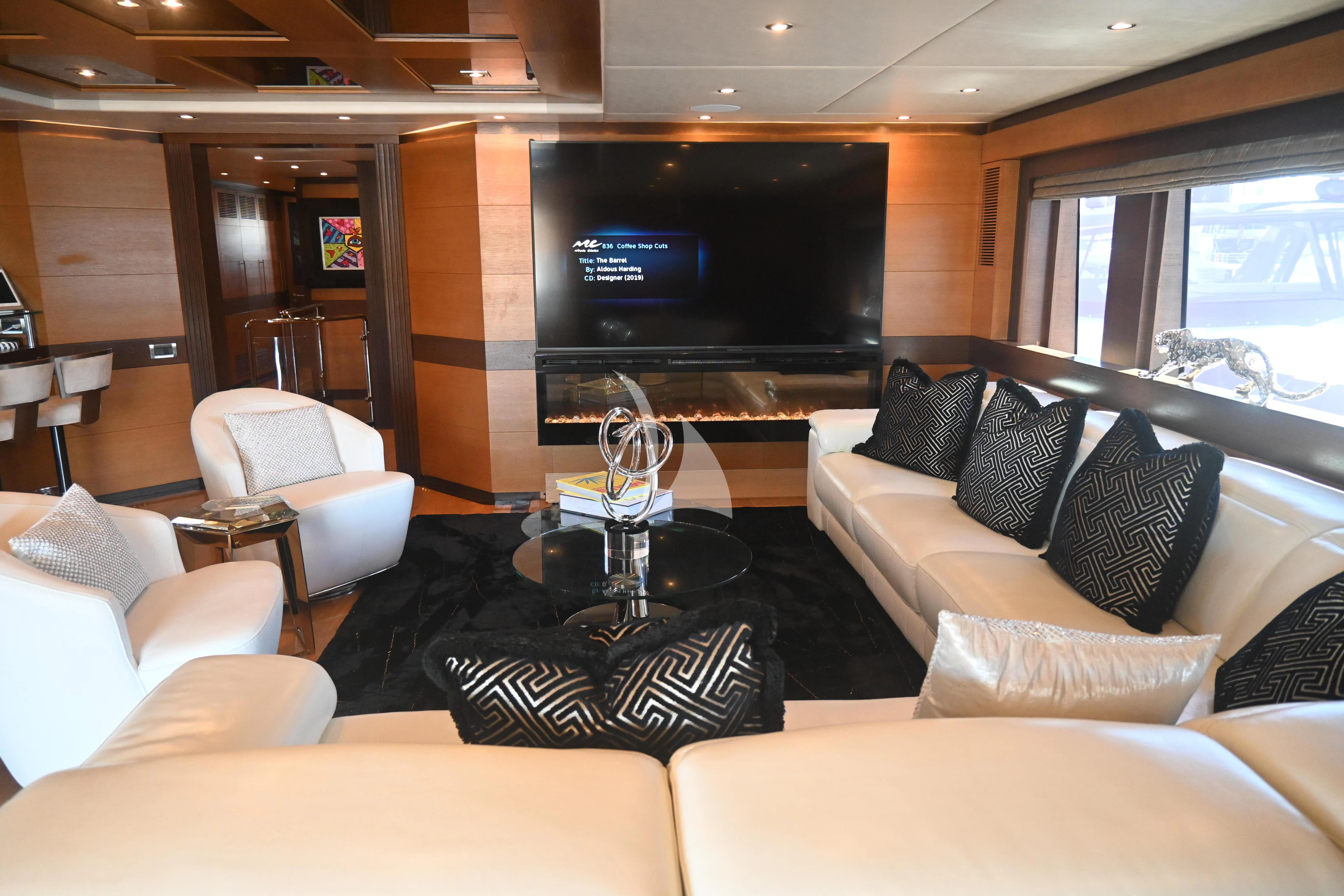 a living room with a large tv aboard KIMBERLIE Yacht for Sale