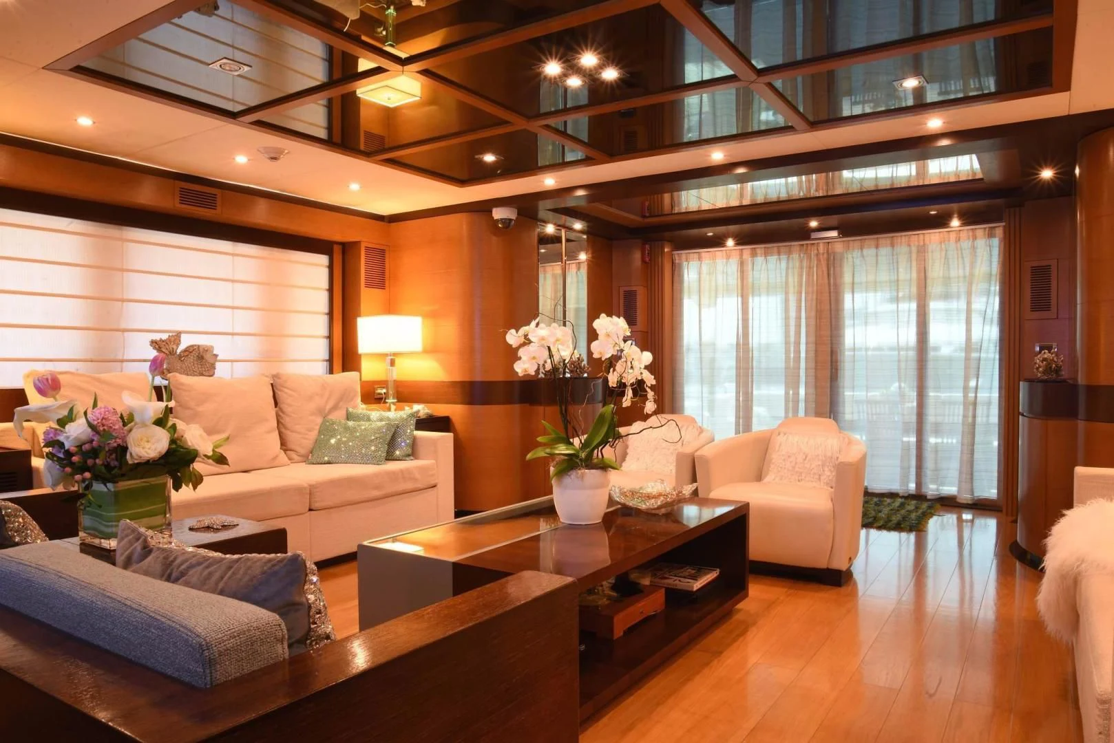 a living room with a table and couches aboard KIMBERLIE Yacht for Sale