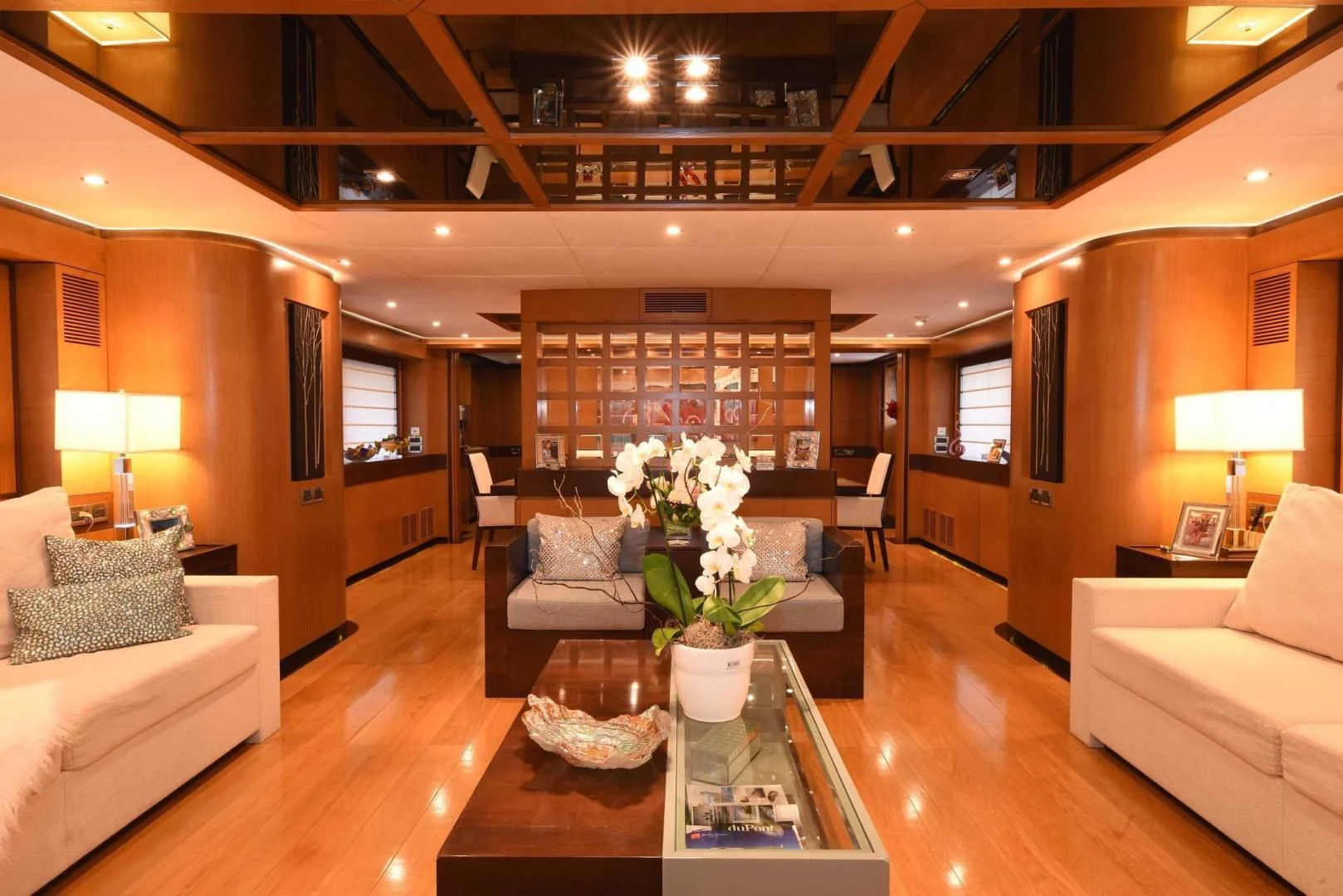 a living room with a table and couches aboard KIMBERLIE Yacht for Sale