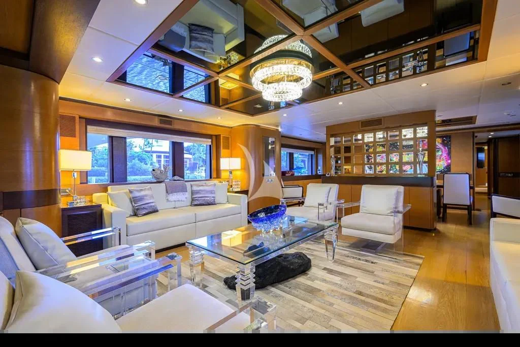 a living room with a large chandelier aboard KIMBERLIE Yacht for Sale