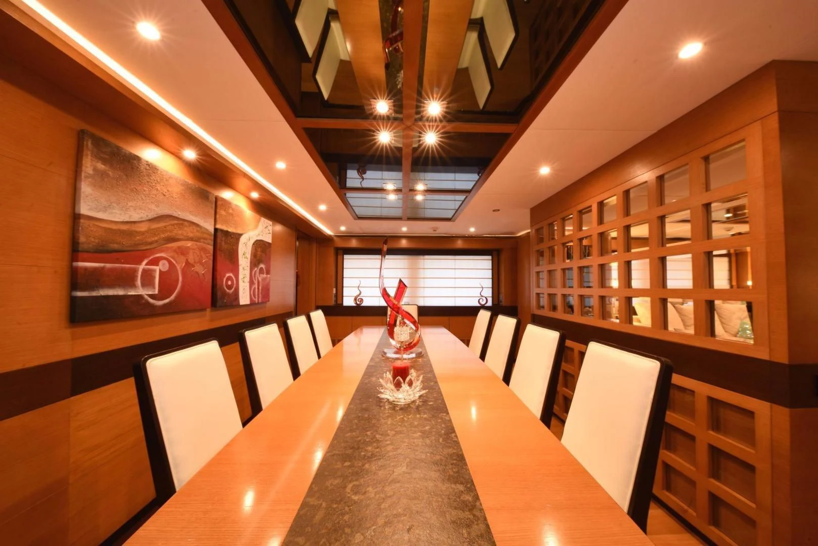 a table with chairs and a chandelier in a room aboard KIMBERLIE Yacht for Sale