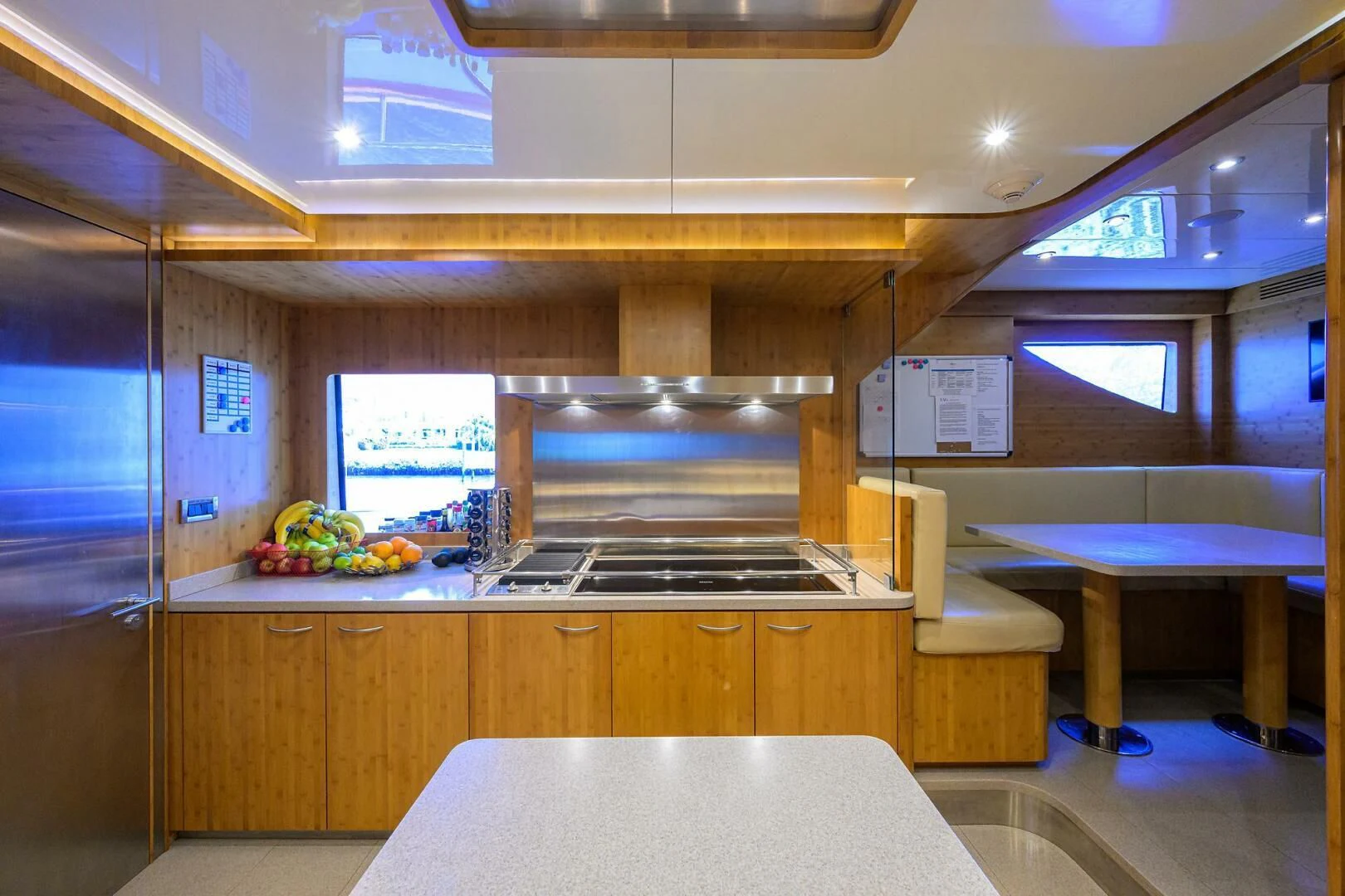 a kitchen with a table and chairs aboard KIMBERLIE Yacht for Sale