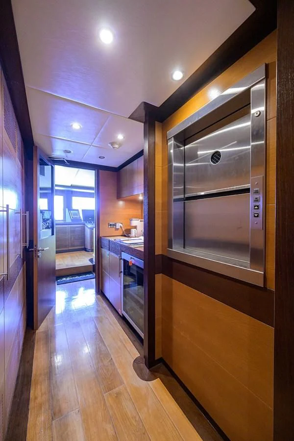 a kitchen with a large glass door aboard KIMBERLIE Yacht for Sale
