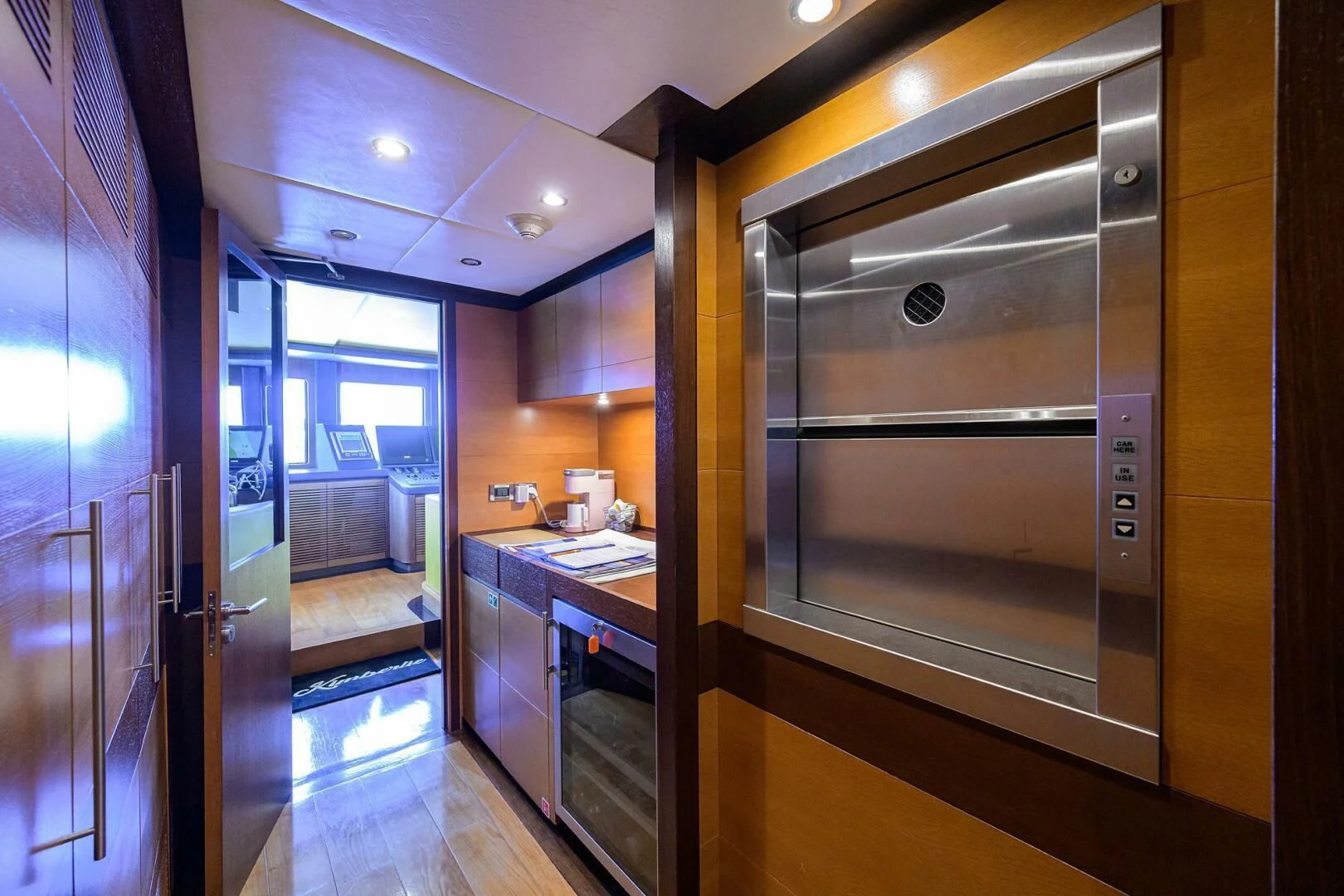 a kitchen with a large glass door aboard KIMBERLIE Yacht for Sale
