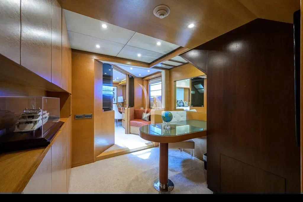 a room with a table and chairs aboard KIMBERLIE Yacht for Sale