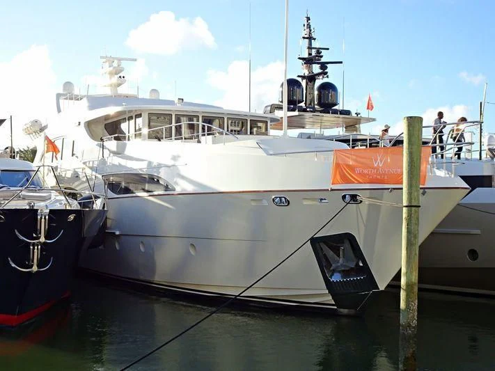 a large white boat in a harbor aboard KIMBERLIE Yacht for Sale