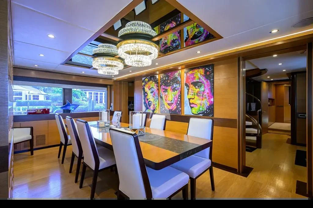 a room with a table and chairs aboard KIMBERLIE Yacht for Sale