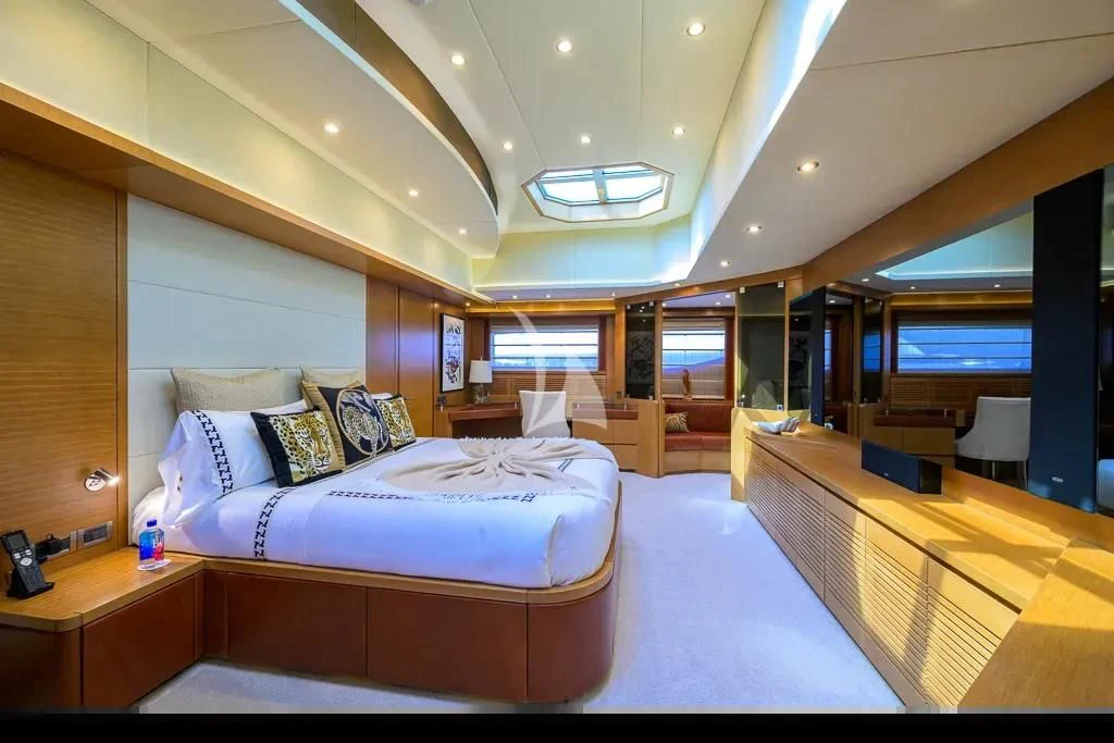 a room with a bed and a desk aboard KIMBERLIE Yacht for Sale
