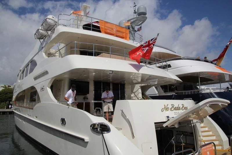 a large white boat with a person standing on the deck aboard KIMBERLIE Yacht for Sale