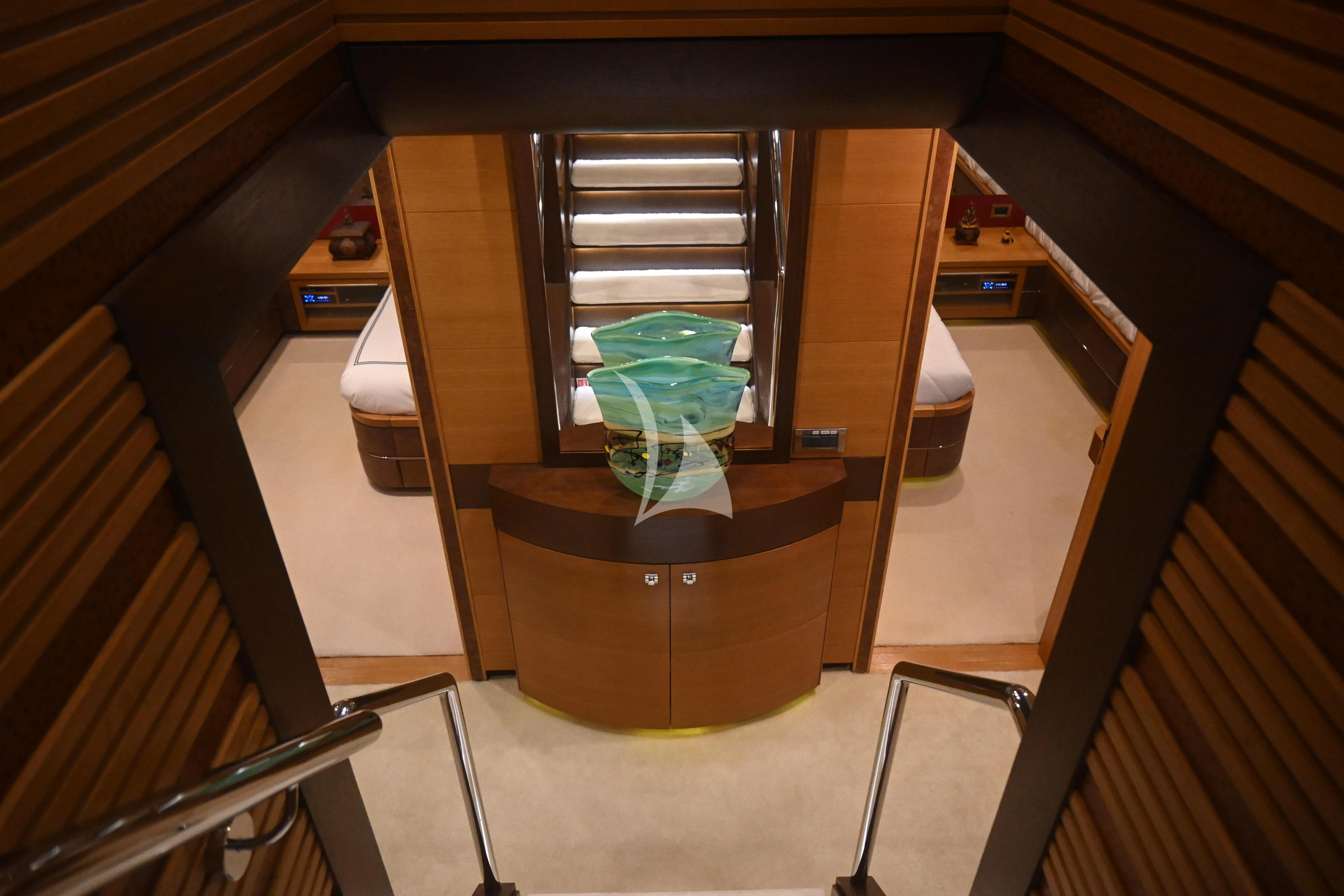 a wood cabinet with a glass door aboard KIMBERLIE Yacht for Sale