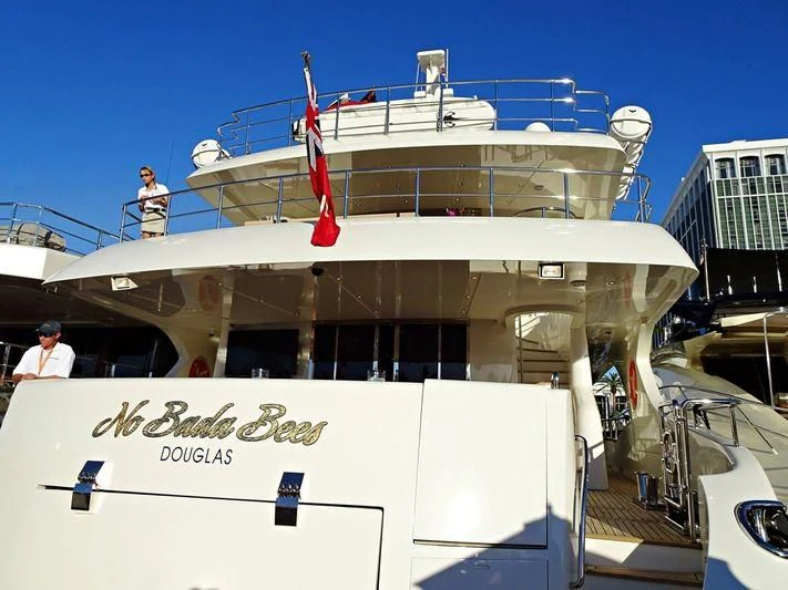a large white boat with a red crane on the deck aboard KIMBERLIE Yacht for Sale