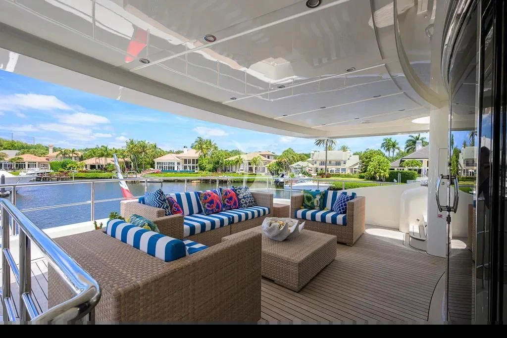 a deck with a view of the ocean and a beach aboard KIMBERLIE Yacht for Sale