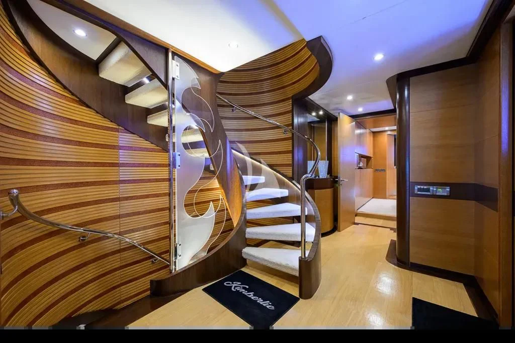 a staircase with a spiral staircase aboard KIMBERLIE Yacht for Sale