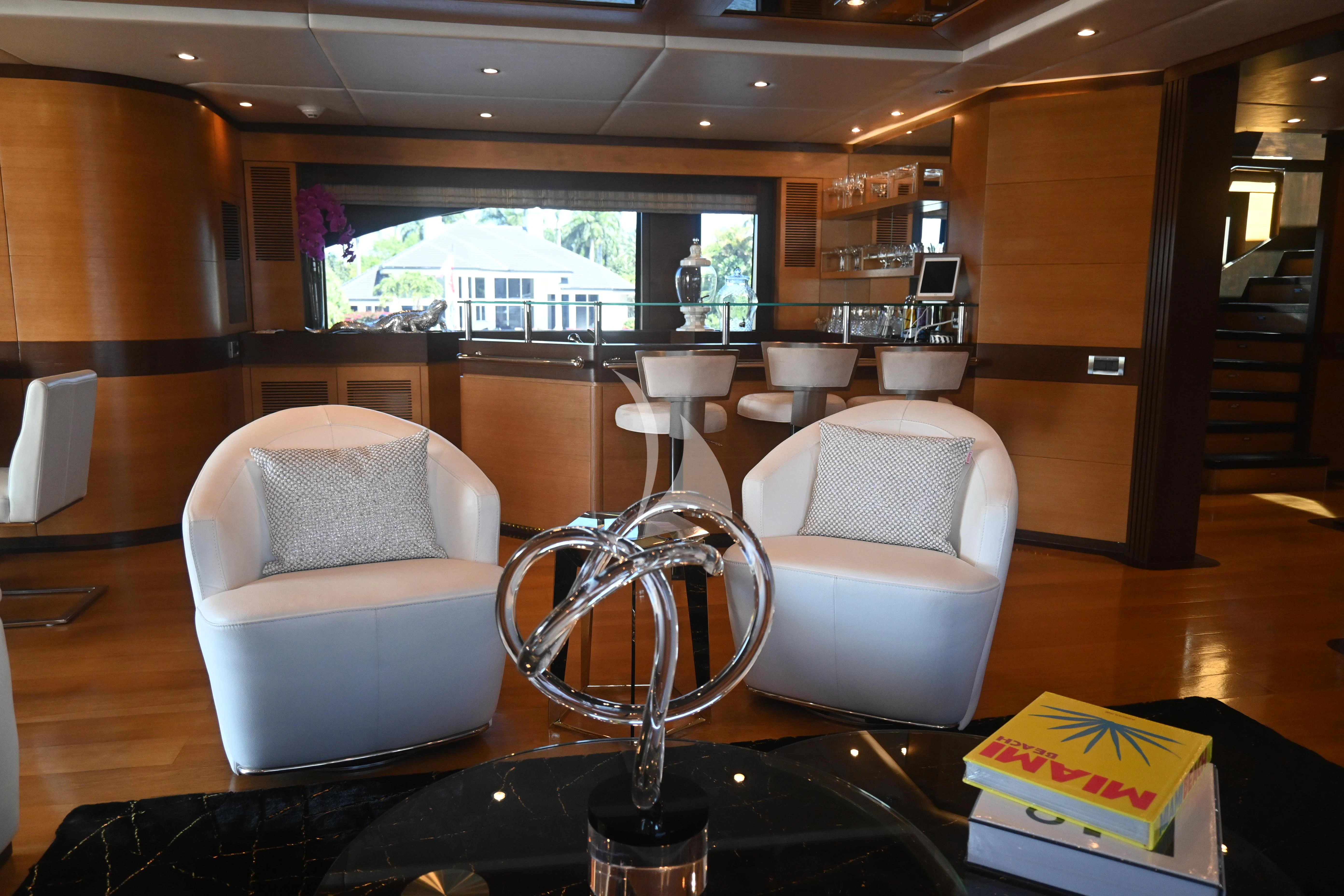 a room with chairs and a table aboard KIMBERLIE Yacht for Sale