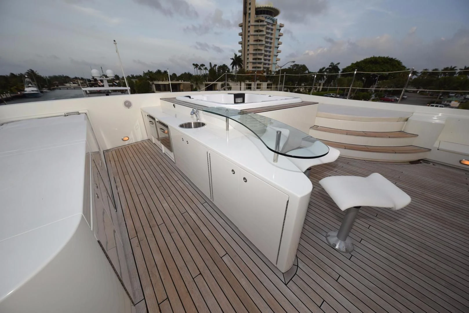 a deck with a boat and chairs on it aboard KIMBERLIE Yacht for Sale