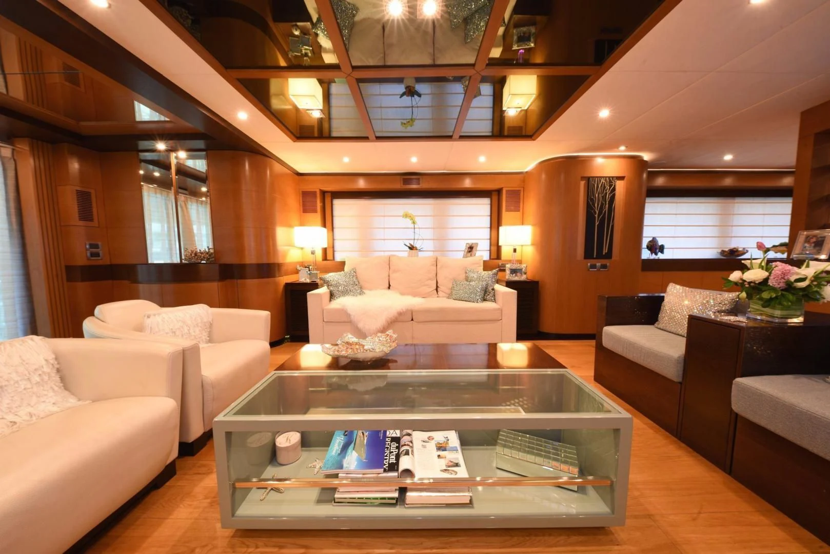a living room with a table and couches aboard KIMBERLIE Yacht for Sale