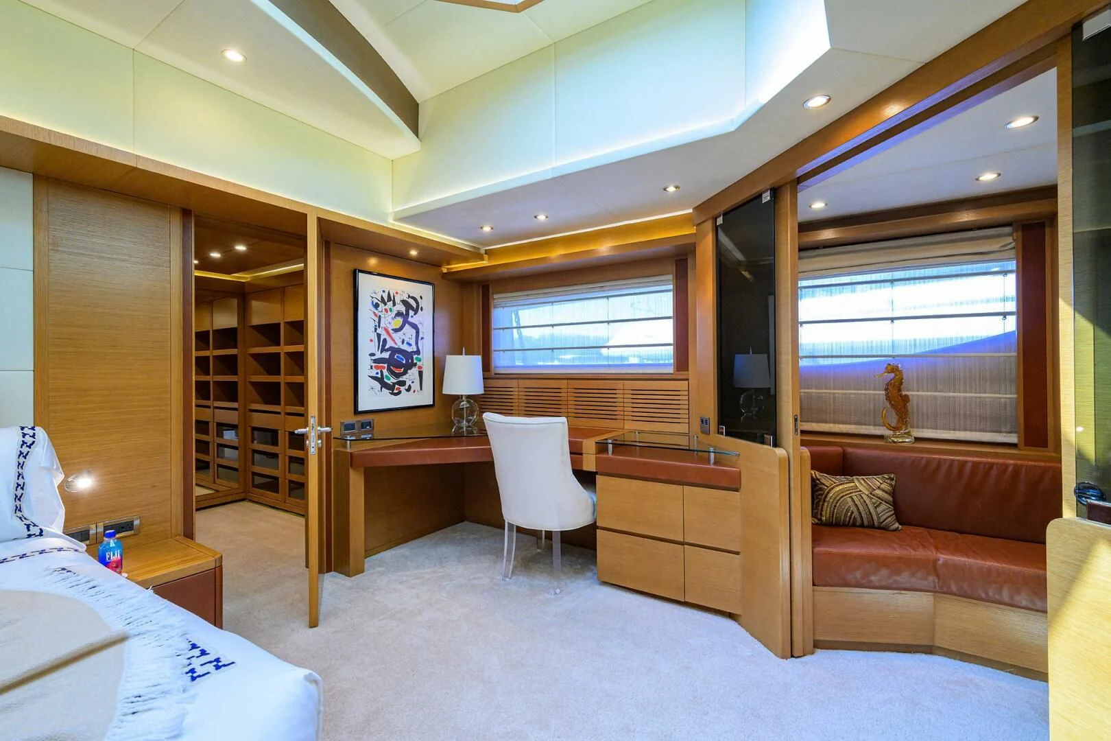 a bedroom with a bed and a desk aboard KIMBERLIE Yacht for Sale