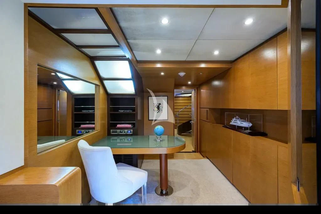 a room with a table and chairs aboard KIMBERLIE Yacht for Sale