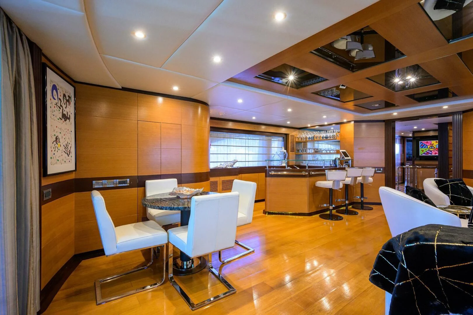 a room with tables and chairs aboard KIMBERLIE Yacht for Sale