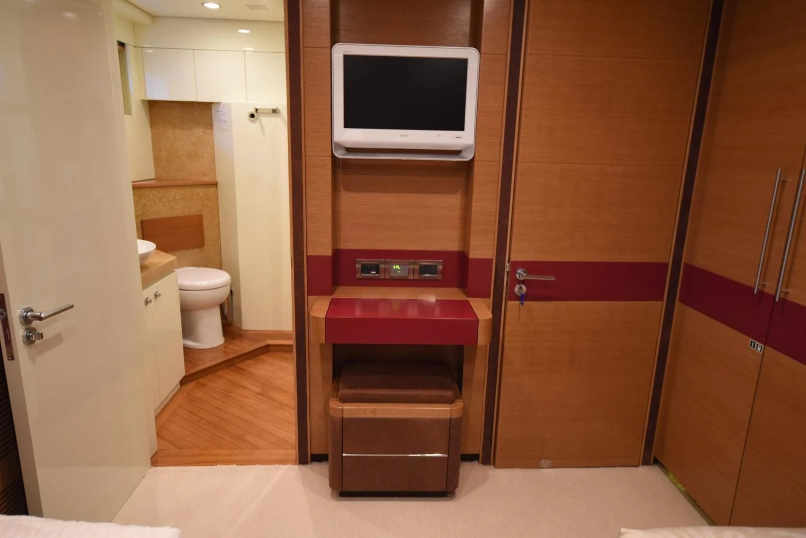 a bathroom with a tv on the wall aboard KIMBERLIE Yacht for Sale