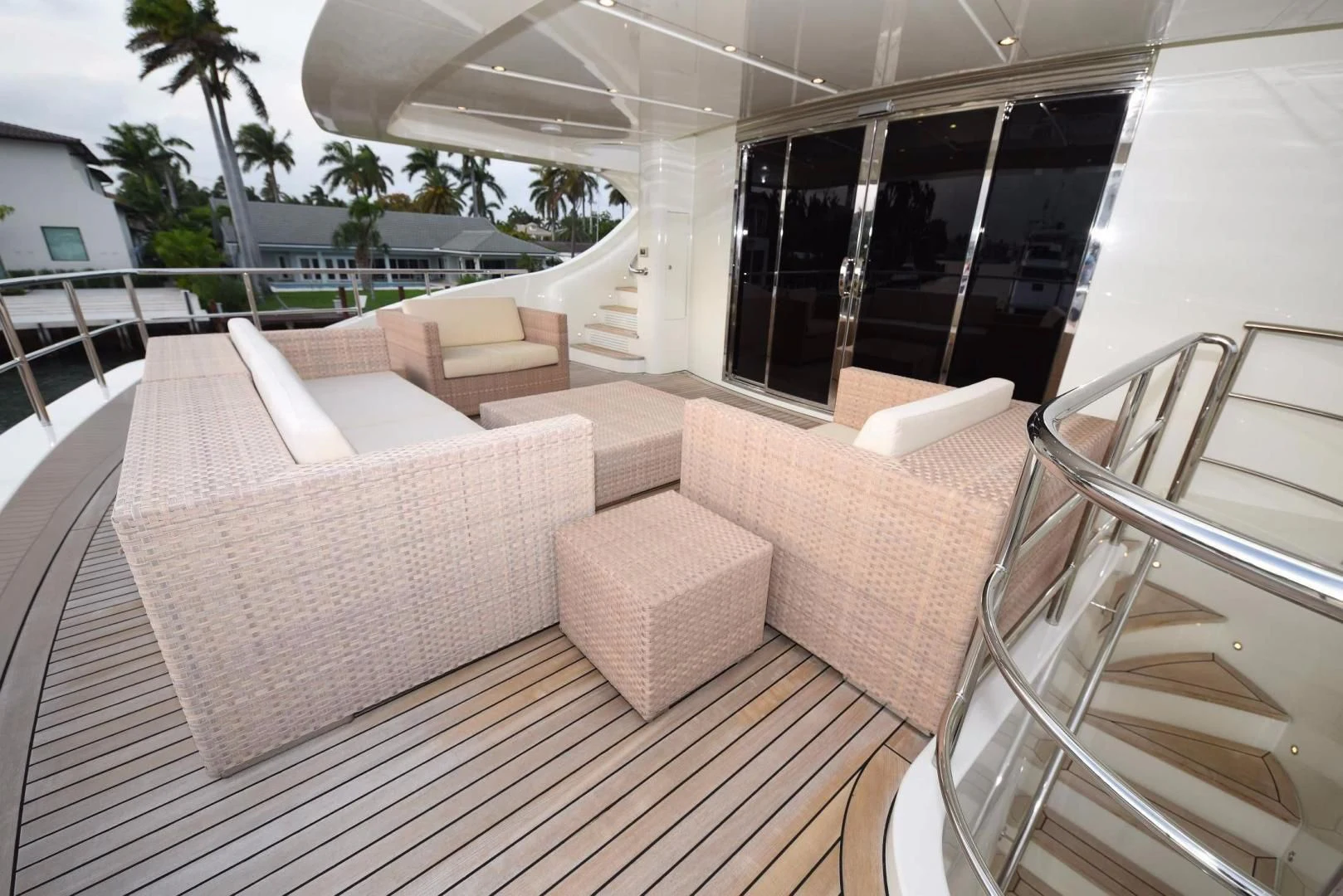a deck with chairs and a table aboard KIMBERLIE Yacht for Sale